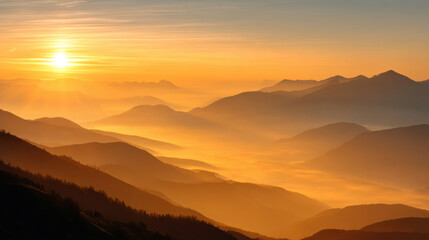 Golden sunrise over mountain range with misty valleys and warm light