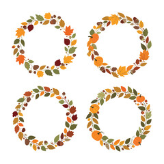 A collection of four circular autumnal wreaths adorned with leaves and pumpkins.