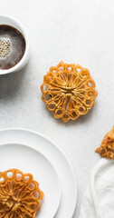 Overhead view of sassafa northern nigerian snack, top view of rosette cookies on a countertop