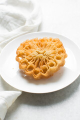Overhead view of sassafa northern nigerian snack, top view of rosette cookies on a countertop