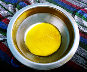 Pure mustard oil in a stainless steel bowl