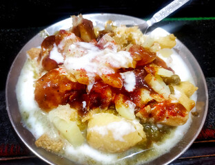Indian Dahi Papdi Chaat with curd, chutney and spices