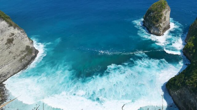 Seascape dark ocean background wave splash on rock. Tropical sea beach in summer seaside outdoor. Water Surface blue wave pattern. Turquoise ocean sea water white wave pattern splashing deep blue sea