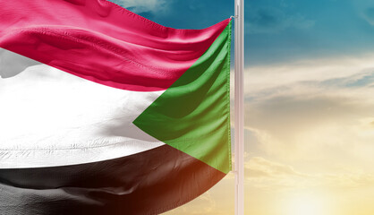 Sudan national flag waving in an amazing sunlight. National flag waving on mast.