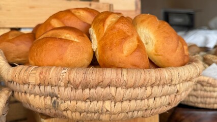 A luxurious hotel breakfast features an extensive selection of baked goods including croissants, bagels, muffins, pastries, breads, cookies, pancakes, waffles, scones, biscuits, donuts, rolls, Danish 