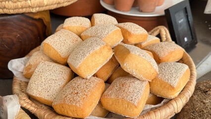 A luxurious hotel breakfast features an extensive selection of baked goods including croissants, bagels, muffins, pastries, breads, cookies, pancakes, waffles, scones, biscuits, donuts, rolls, Danish 