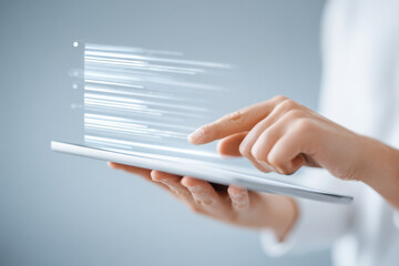 person holding tablet displaying list of job vacancies while soft ar blurred white text bars overlay screen