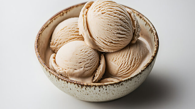 A rustic bowl with almond milk ice cream scoops slightly textured and gently melting, natural light from the side highlighting creamy ripples, white background,