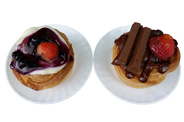 These cakes adorned with toppings and fresh fruit make delightful treats, evoking feelings of joy and delicious anticipation