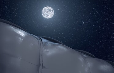 Full moon over a futuristic structure and starry night sky