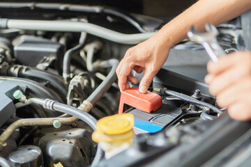 Obraz premium Repair and service. Mechanic open vehicle hood checking up auto mobile.