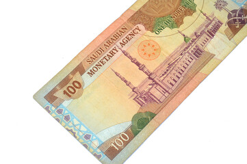the reverse side of 100 SAR one hundred Saudi Arabian riyals cash money banknote bill, features a general view of the Holy Prophet's Mosque at Madina, old vintage retro Saudi money