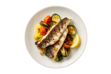 Grilled fish with roasted vegetables and lemon wedge on a white plate, isolated on transparent background