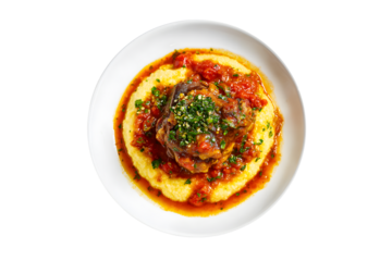 Ossobuco with polenta and fresh parsley garnish on a white plate, isolated on transparent background