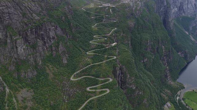 Drone aerial view of a winding road up a mountainside in lysebotn, norway