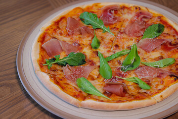 Gourmet Pizza Delights: A delectable pizza with a thin, crispy crust, lavishly topped with flavorful ingredients, ready to be savored. The perfect culinary delight.
