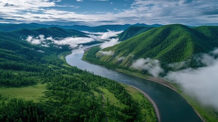 Aerial View of Lush Green Mountains Surrounding a Serene River with Soft Morning Fog