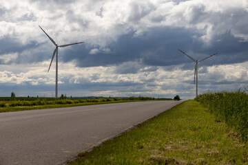 Windmills in the fields are mainly used to produce green electricity from wind
