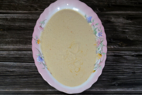Tahini Tahina which is a Middle Eastern condiment made from toasted ground hulled sesame, served by itself (as a dip), with spices and herbs, Seafood Tahini used as a dip and an appetizer side plate