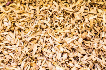 A background of dried orange blossoms. Flower tea to restore the body, fight viruses. Gorgeous citrus taste. selective focus. A copy of the space.