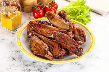 Roasted duck wings with sauce