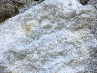 Close-up of rough beige and white rock texture