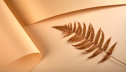 Dried fern leaf artfully arranged on a muted beige surface with a gentle paper curl, creating a serene and elegant composition that evokes natural beauty and warm, earthy tones