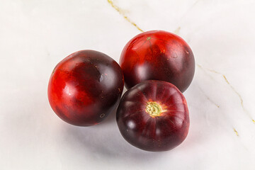 Black ripe juicy organic tomato