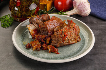 Baked beef ribs with vegetables