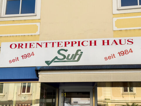 Wolfsberg, Austria - September 19, 2025: Orientteppich Haus storefront sign displaying Sufi brand, established since 1984, showcasing vibrant colors and inviting atmosphere for carpet enthusiasts
