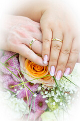 wedding rings in hands