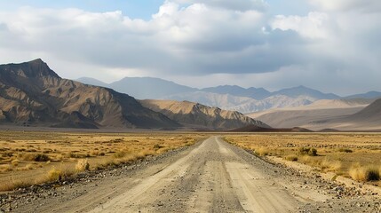 Fototapeta premium Desert road scenery Arid Serenity: Breathtaking Desert Road Scenery – A Long, Winding Asphalt Road Stretching Through Golden Sand Dunes and Scattered Desert Shrubs, Under a Clear Blue Sky