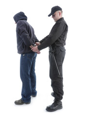 Policeman handcuffing hooded man, shot on white