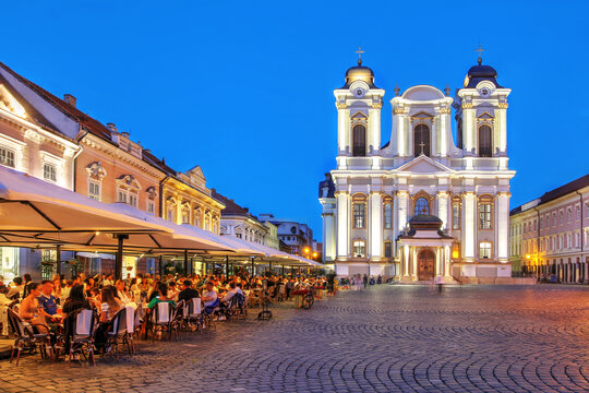 Roman-Catholic Dome, Union Square (Piata Unirii) in Timisoara, Romania during a summer evening
