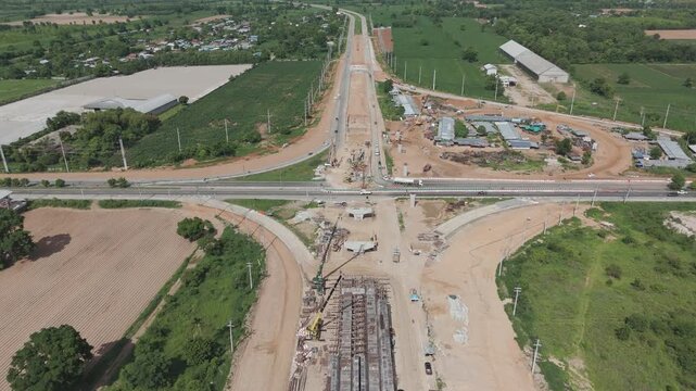 Aerial view drone footage of bridge construction being made across the intersection