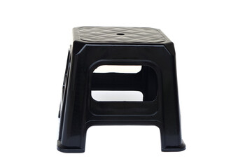 A black plastic stool with a simple and durable design, isolated on white background. Perfect for household, kitchen, garden, or office use, lightweight and easy to clean.      