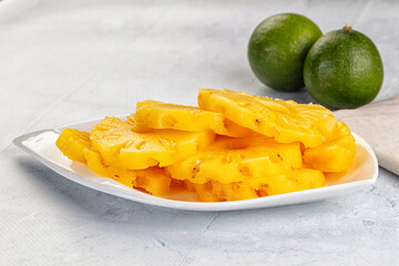 Sweet canned pineapple slices in syrope