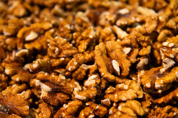 Walnuts close-up. Healthy eating, a large pile of peeled, freshly roasted walnuts. A nut that improves brain function