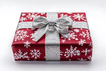Stunning red gift box adorned with elegant silver glitter bow and festive white snowflakes, perfect for Christmas celebrations and holiday surprises.