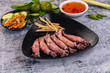 Boiled wild mini calamari snack