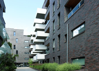 Contemporary appartment buildings with balconies around a  greened yard in the city (Oslo, Norway)
