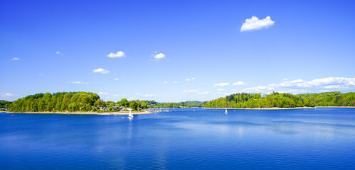 View of the Bevertalsperre and the surrounding landscape. Nature at the dam in the Oberbergischer...