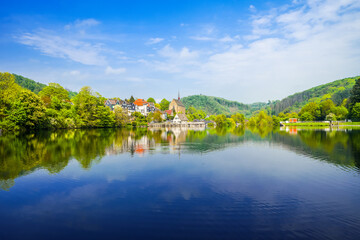 Fototapeta premium View of the Beyenburg Reservoir and the surrounding landscape. Nature near Beyenburg at the dam in the Bergisches Land region. 