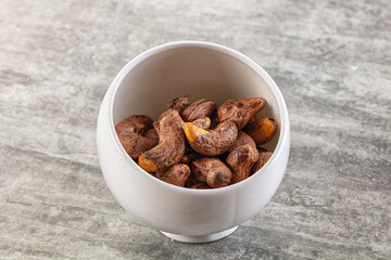 Unpeeled cashew nuts in the bowl