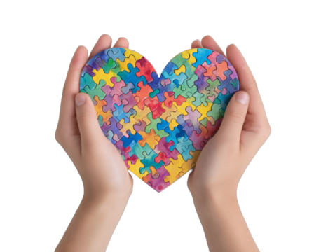 hands holding a puzzle in the shape of a heart