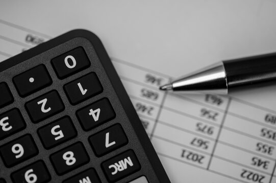 Calculator and financial data table, reverse, upside down, creative accounting
