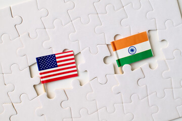 United States and India flags on puzzle pieces, symbol of partnership, cooperation, and international relations