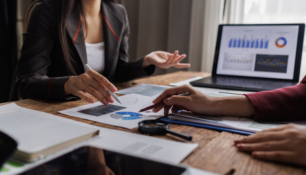 Business Presentation and accounting Financial Analysis. Professional woman presenting accounting data to colleague.
- Powered by Adobe