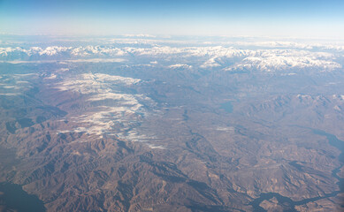 Naklejka premium Plane Window View, Snow Mountains Aircraft Fly Landscape, Looking from Plane Cabin