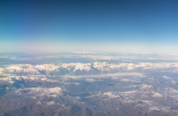 Naklejka premium Plane Window View, Snow Mountains Aircraft Fly Landscape, Looking from Plane Cabin